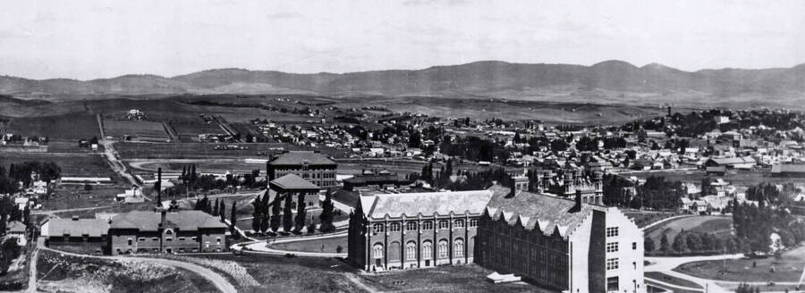 1912 panoramic photograph of University of Idaho campus. Southwest view of the Administration Building, Moscow Mountain in the background. Donor: Publications Dept. [PG1_002-30]