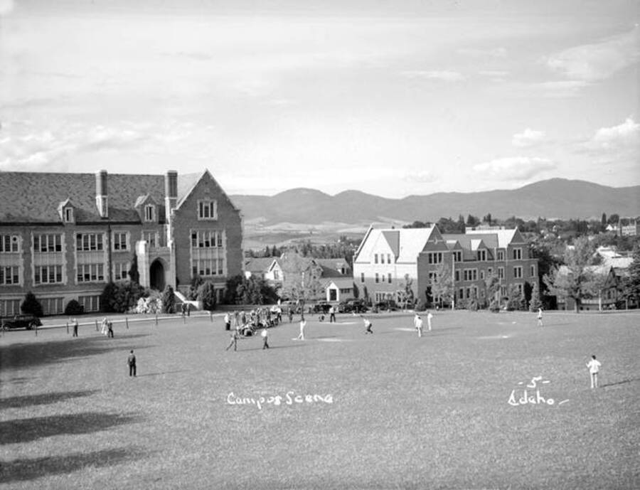 1936 panoramic photograph of University of Idaho campus. Students playing baseball on the Administration lawn. [PG1_002-49]