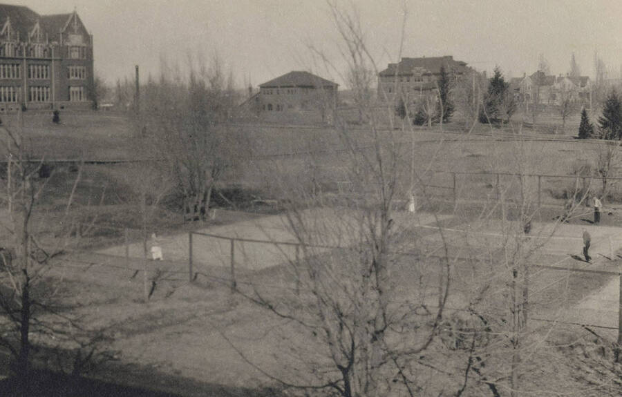 1920 panoramic photograph of University of Idaho campus. Tennis courts in front of Ridenbaugh Hall. Donor: University Relations. [PG1_002-59]