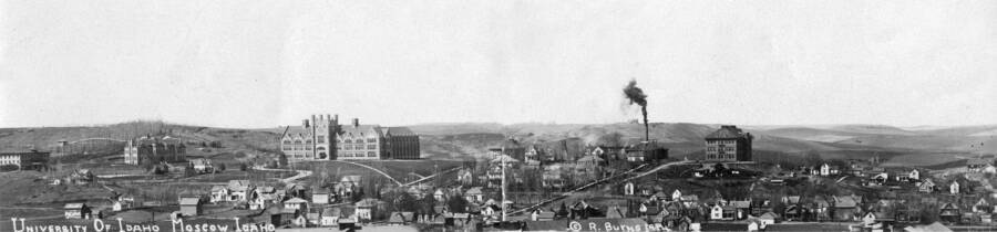 1914 panoramic photograph of University of Idaho campus. Looking west onto campus with the town of Moscow in the lower right. [PG1_002-61]