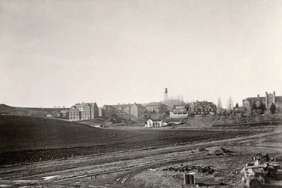 1930 panoramic photograph of University of Idaho campus. View from the brickyard to administration Building on the right and the water tower to the left. [PG1_002-65]
