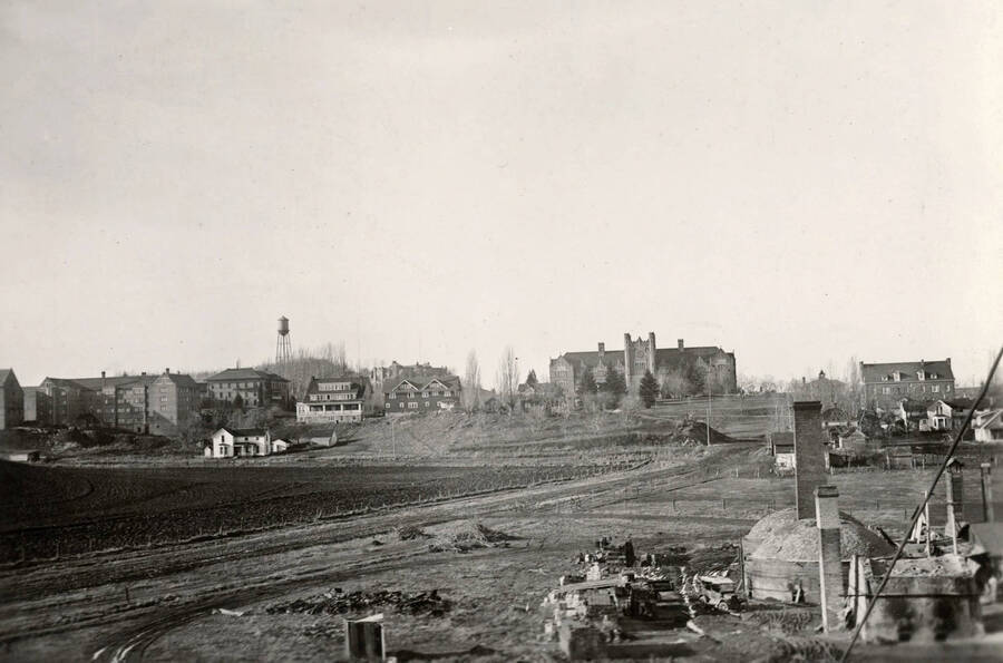 1930 panoramic photograph of University of Idaho campus. View from the brickyard to administration Building on the right and the water tower to the left. [PG1_002-66]