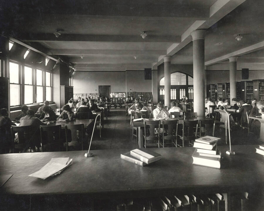 1917 photograph of the Library. Students studying in the background. [PG1_201-01]