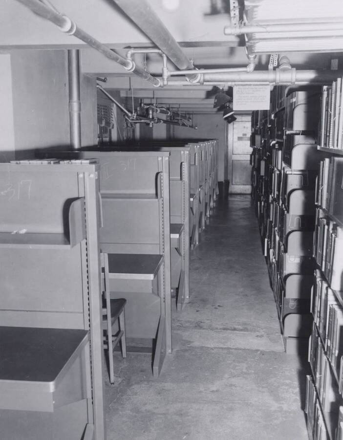 1957 photograph of the Library. Study carrels and stacks. [PG1_201-25]