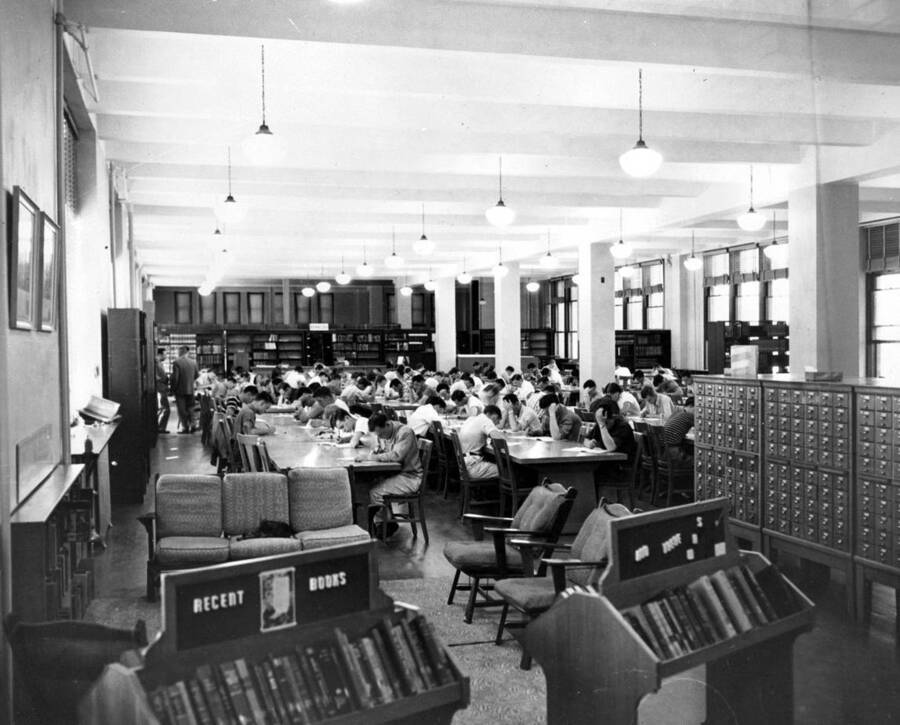 1950 photograph of the Library. Students study in the reading room. [PG1_201-26]