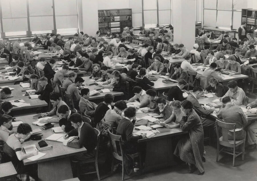 1934 photograph of the Library. Students study in the main reading room. [PG1_201-27]