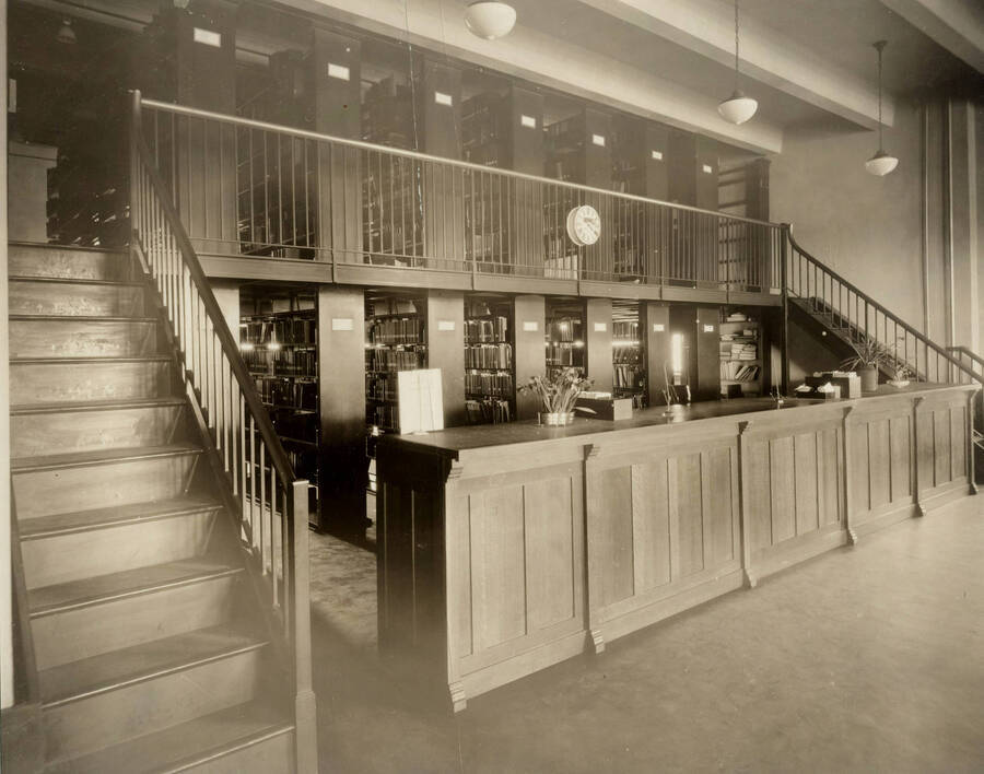 1922 photograph of the Library. Closed stacks behind desk. [PG1_201-04]