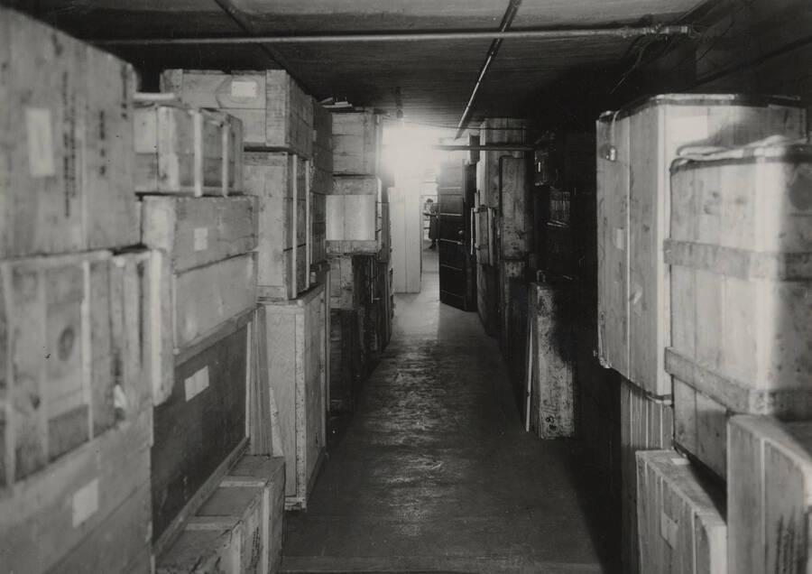 1934 photograph of the Library. Crates in basement storage. [PG1_201-09]