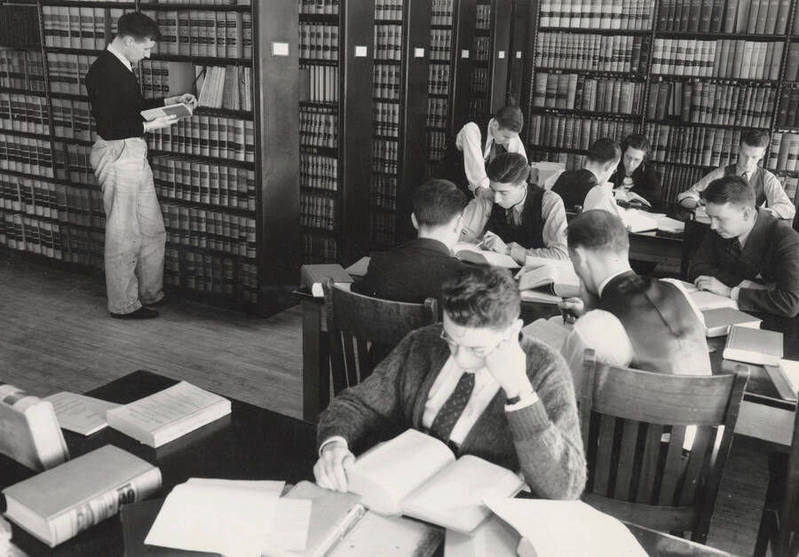 1935 photograph of the Law Library. Law students study at tables. [PG1_202-02]