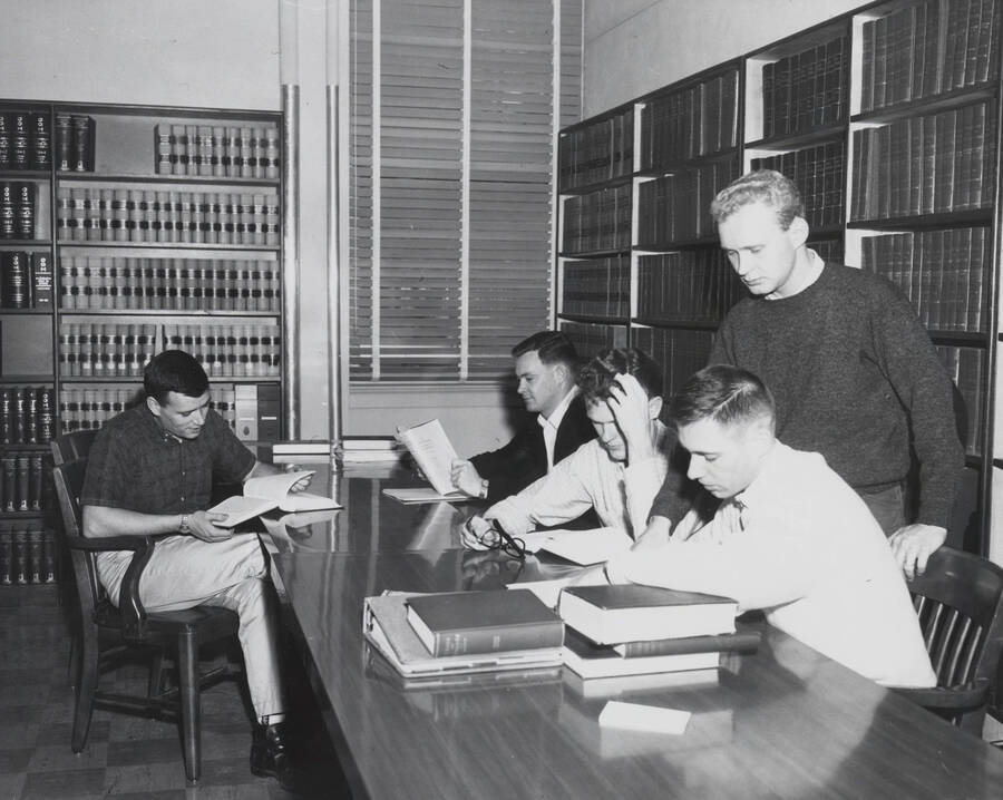 1961 photograph of the Law Library. Students studying in foreground. Donor: Photo Center. [PG1_202-03]