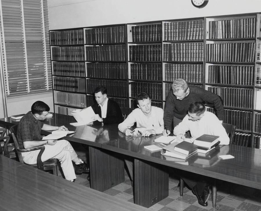 1961 photograph of the Law Library. Students studying in foreground. Donor: Photo Center. [PG1_202-04]