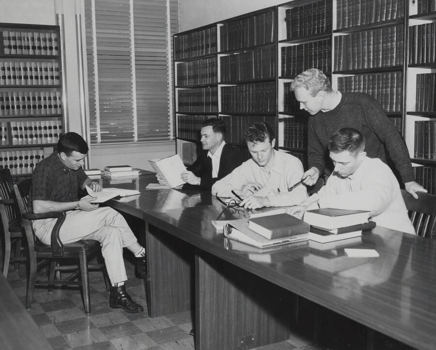 1961 photograph of the Law Library. Students studying in foreground. Donor: Photo Center. [PG1_202-05]