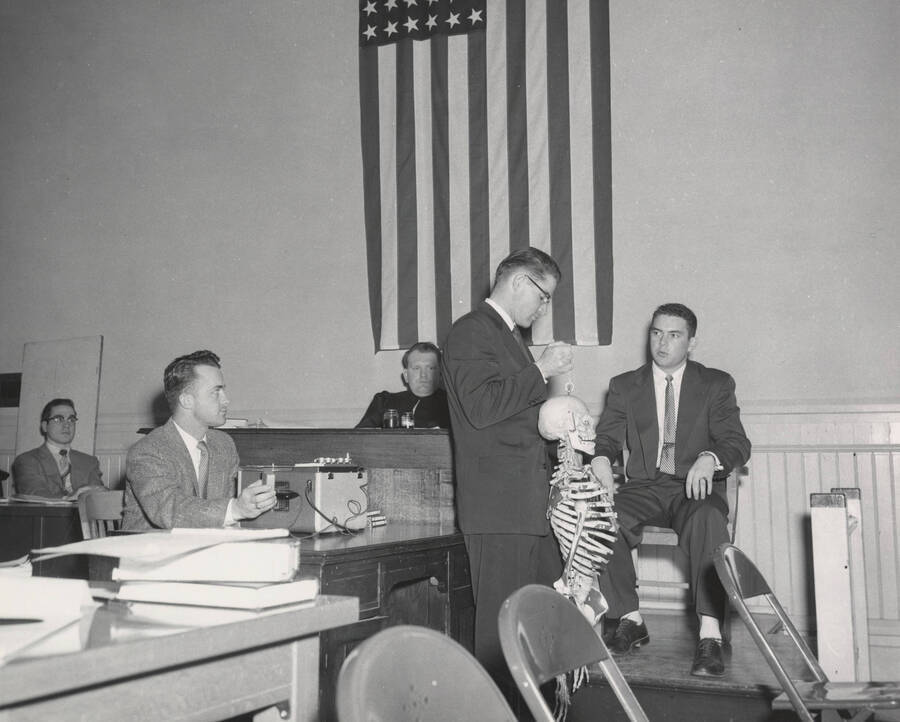 1952 photograph of the College of Law. Students participate in a mock trial. [PG1_203-03]