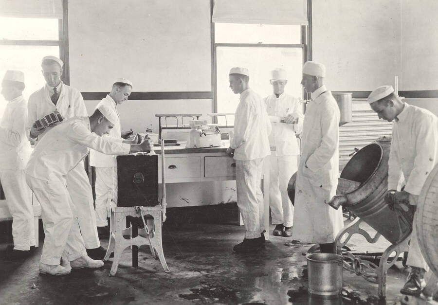 1925 photograph of Dairy Farm and Creamery. Students make butter in a classroom. [PG1_205-19]