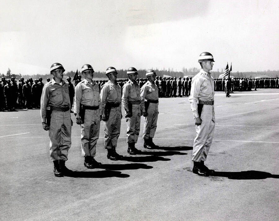 1960 photograph of Military Science Cadets. John A. McFarland and his staff during brigade review. Donor: Army ROTC. [PG1_208-109]
