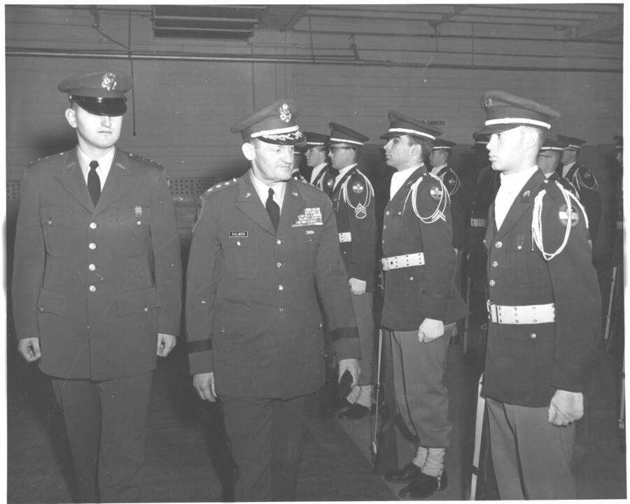 1958 photograph of Military Science Cadets. Cadets are inspected by General Charles Palmer. Donor: Publications Dept. [PG1_208-124]