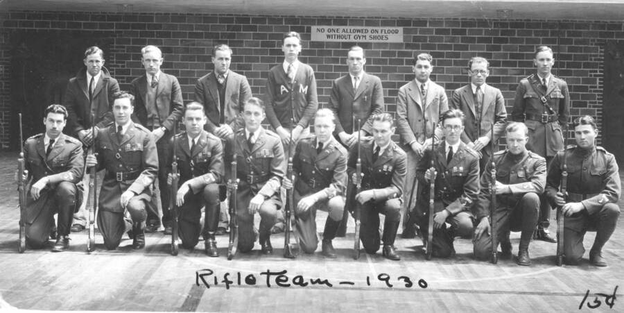 1930 photograph of Military Science Cadets. Rifle team inside gymnasium. Donor: Gerald Hodgins. [PG1_208-136]