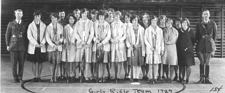 1929 photograph of Military Science Cadets. 'Girls Rifle Team.' inside gymnasium. Donor: Gerald Hodgins. [PG1_208-137]