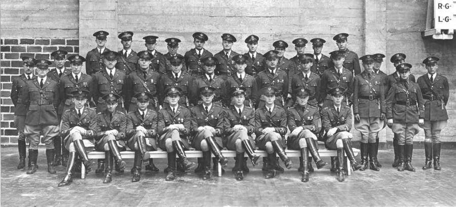 1932 photograph of Military Science Cadets. Senior officers standing against a wall.Donor: Gerald Hodgins. [PG1_208-145]
