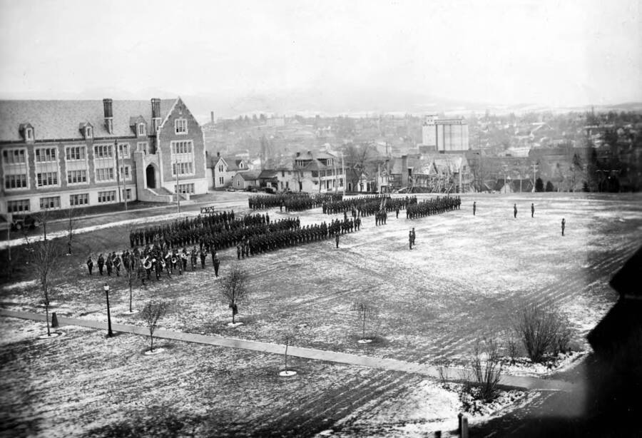 1925-12-05 photograph of Military Science Cadets. ROTC regiment in parade formation in front of Science building. [PG1_208-157]