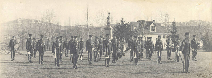 1909 photograph of Military Science Cadets. Military band in formation in front of the Spanish-American War Memorial. [PG1_208-016]