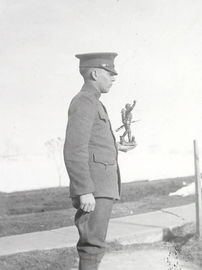 1922 photograph of Military Science Cadets. Marksmanship trophy winner in field. [PG1_208-018]