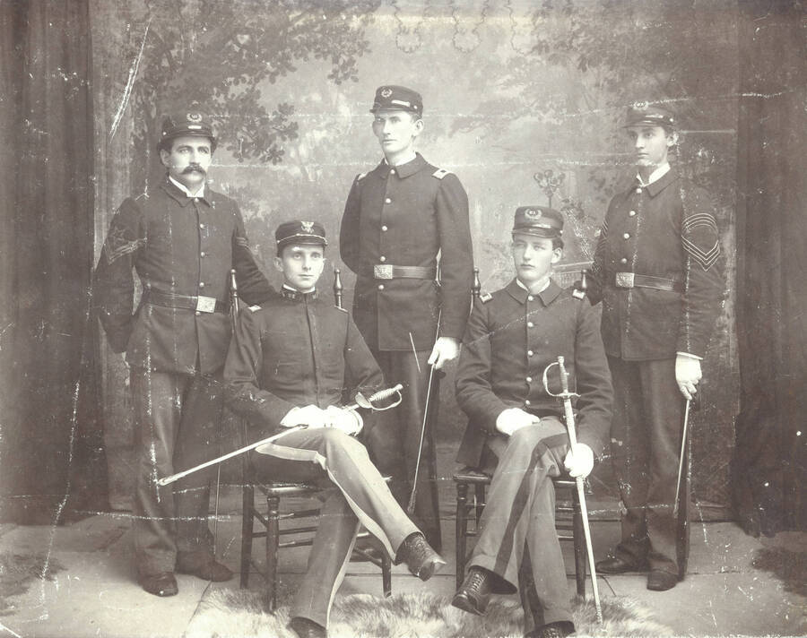 1897 photograph of Military Science Cadets l-r: Winslow M. Howland, E.R. Chrisman, Gilbert Hogue, Charles Simpson, Paul Draper. Portrait of Battalian staff. Donor: UofI Army ROTC. [PG1_208-005]