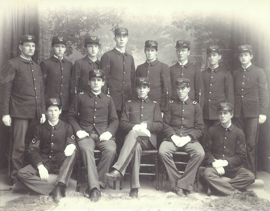 1897 photograph of Military Science Cadets l-r: (front) J. McNab, O. Hagberg, C.H. Armstrong, H.H. Hoagland, R.W. Fishere; (back) unidentified, C. Herbert, J.L. Raines, G. Snow, C.A. Fisher, H. Lancaster, I.D. Schuh, L.E. Hanley. Portrait of Company 'A' officers. Donor: UofI Army ROTC. [PG1_208-006]