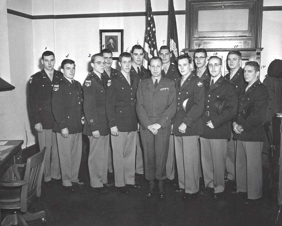 1953-02-01 photograph of Military Science Cadets. Students receiving commissions l-r: A.G. Cranston, E.C. Lungren, T.L. McDaniel, J.S. Hutchins, W.F. Rigby, J.M. Thomas, Lt. Col. A.E. Blewett, N.W. Bettis, G.C. Mattson, R.S. Kleffner, J.H. Olmsted, A.J. Dombrowski, J.T. Moore. [PG1_208-060]