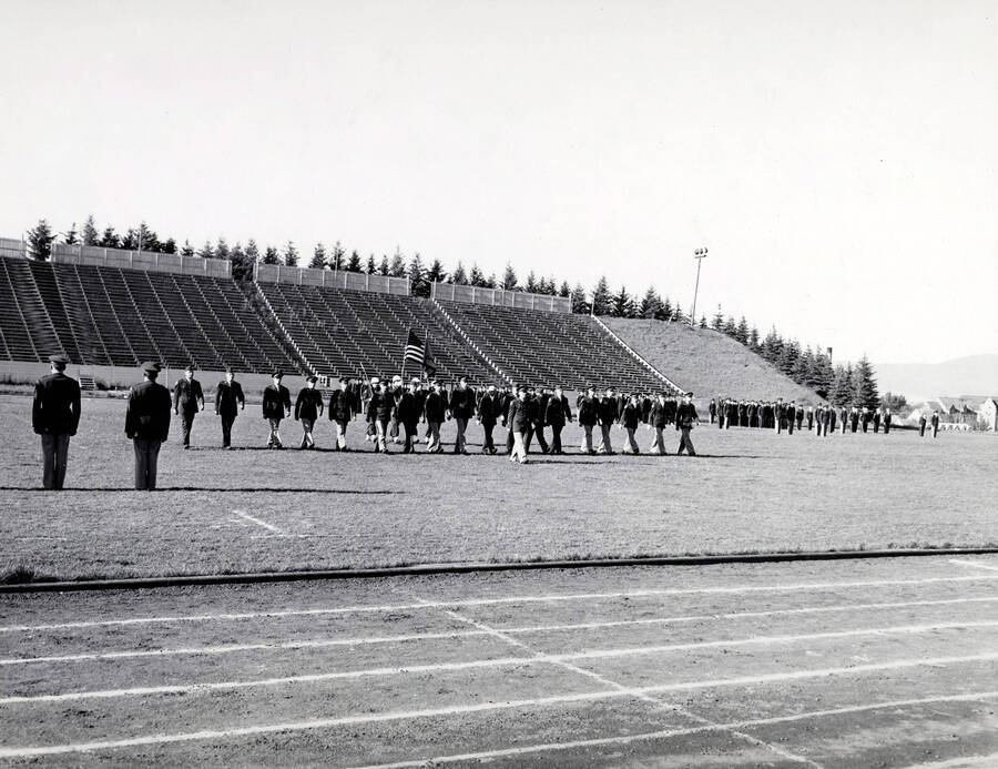 1953 photograph of Military Science Cadets Also print. Military cadets on parade at MacLean field. [PG1_208-068]
