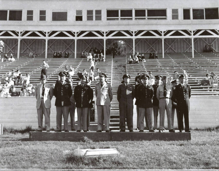 1953 photograph of Military Science Cadets. Officers reviewing cadets at MacLean field. [PG1_208-071]