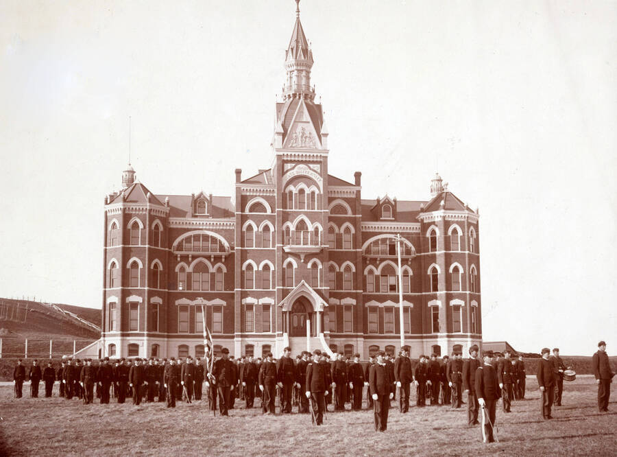 1896-04-01 photograph of Military Science Cadets. Military cadets in formation for review in front of the old Administration building. Donor: Homer David. [PG1_208-085]