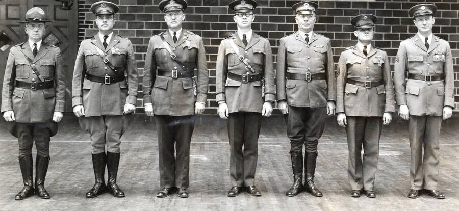 1933 photograph of Military Science Cadets l-r: Edward R. Chrisman, Harry Lynn Henkle, William Allen Hale, John Wyville Sheehy, Bernt Nielson, Lonnie Woods, Frank L. Barnum.. [PG1_208-087]