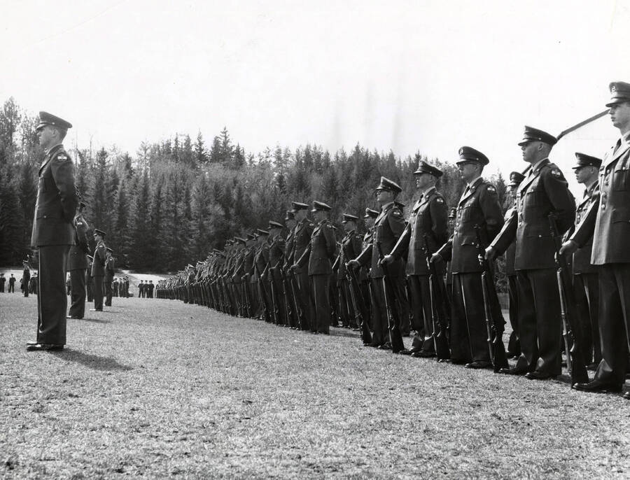 1963 photograph of Military Science Cadets. Military cadets in formation at parade rest. Donor: Army ROTC. [PG1_208-088]