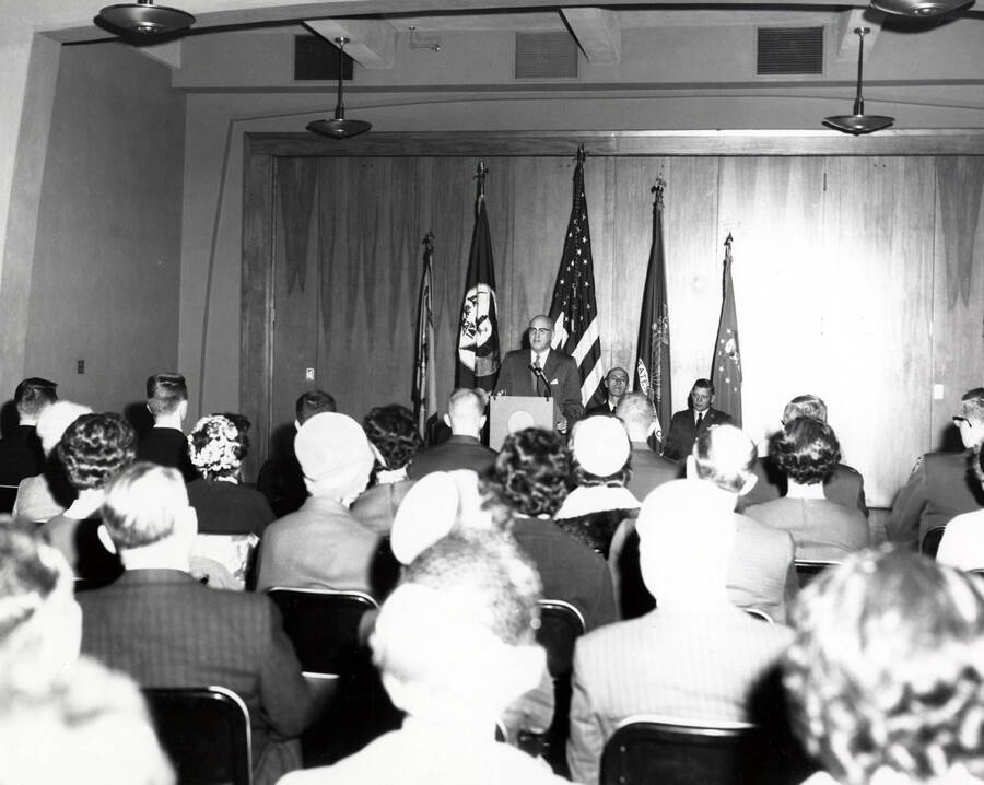 1962 photograph of Military Science Cadets. President Theophilus at lecturn during mid-term commissioning ceremony. Donor: Army ROTC. [PG1_208-089]