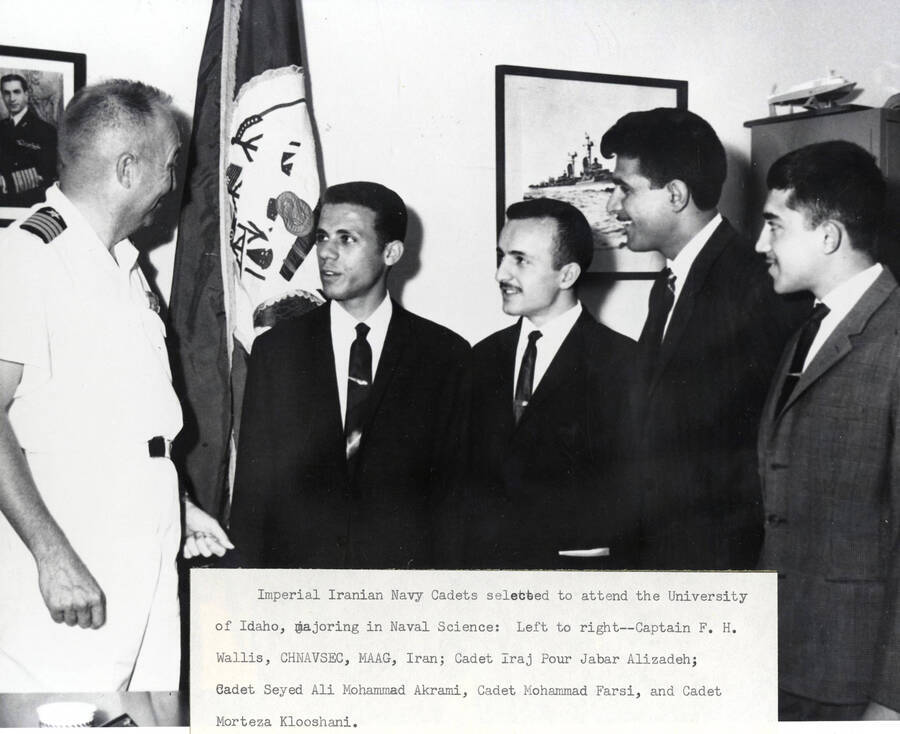 1965 photograph of Naval Science. Imperial Iranian Navy candidates selected to attend the Naval Science program. l-r: Captain F.H. Wallis, I.P.J. Alizadeh, S.A.M. Akrami, M. Farsi, M. Klooshani.. Donor: Publications Dept.. [PG1_209-08]