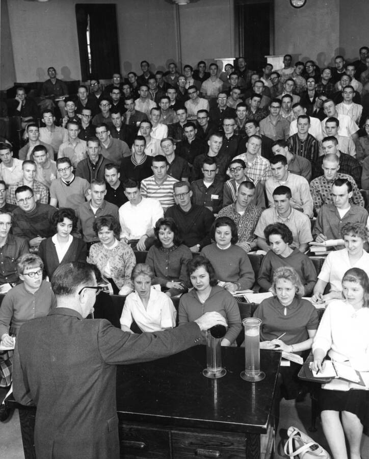 1960 photograph of Chemistry Class. Dr. Jolley lectures students during class. [PG1_211-13]
