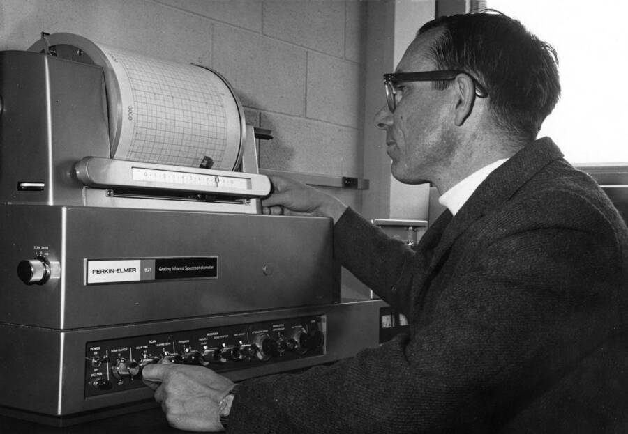 1968 photograph of Chemistry Class. James H. Cooley operates a new grating infrared spectrophotometer. [PG1_211-20]
