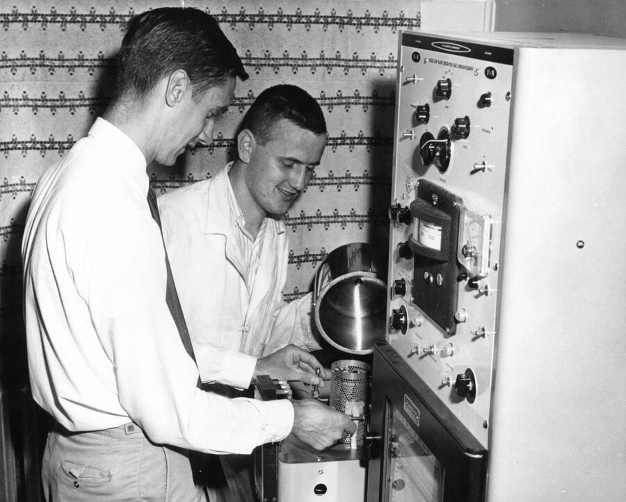 Chemistry. University of Idaho. Peter Freeman and Bruce D. Gesner assembling flame ionization gas chromatograph. [211-22]