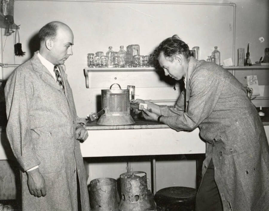 1948 photograph of Agricultural chemistry building. Professors work in the lab. [PG1_216_10]