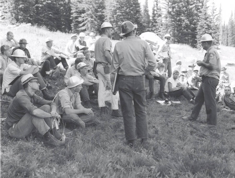 1966 photograph of College of Forestry. Students sitting on a hillside during the forestry summer camp. Also print. Donor: Fred Johnson. [PG1_218-69c]