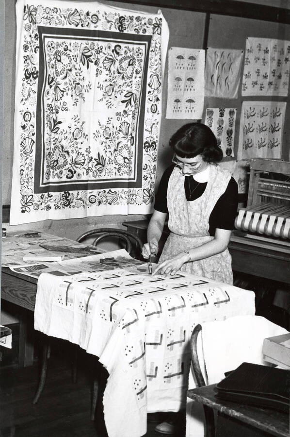 1945 photograph of Home Economics. A student works in the textiles laboratory. [PG1_221-023]