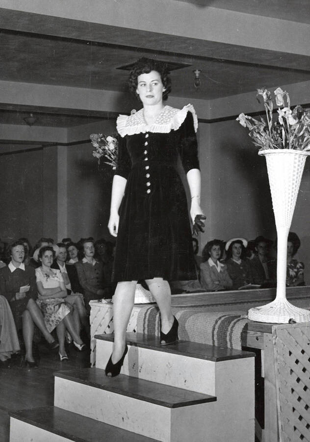 1942-05-02 photograph of Home Economics. A student modeling a dress during a fashion show. [PG1_221-026]