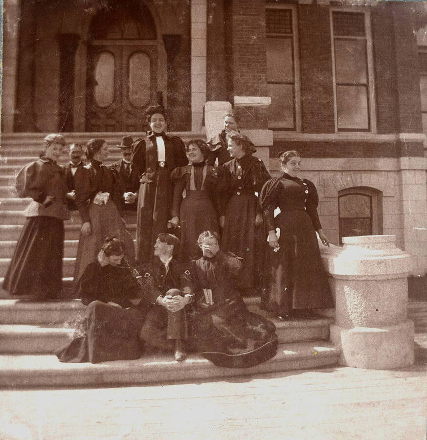 1897-06-13 photograph of Home Economics. Home Economics students on the steps of the Administration building [PG1_221-035]