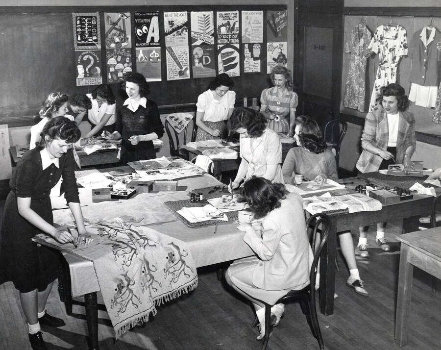 1943-05-17 photograph of Home Economics. Students work at tables during art and design class. Donor: Publications Dept. [PG1_221-066]