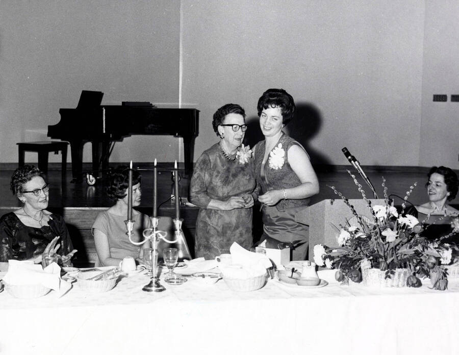1965 photograph of Home Economics. Margaret Ritchie, retiring professor of Home Economics and Darlene Dougherty, past president of Home Economics Club. Donor: Publications Dept. [PG1_221-079]