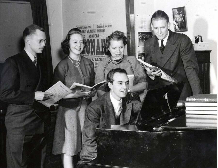 1940 photograph of Music Department. A.A. Becker rehearses at a piano [PG1_222-011]