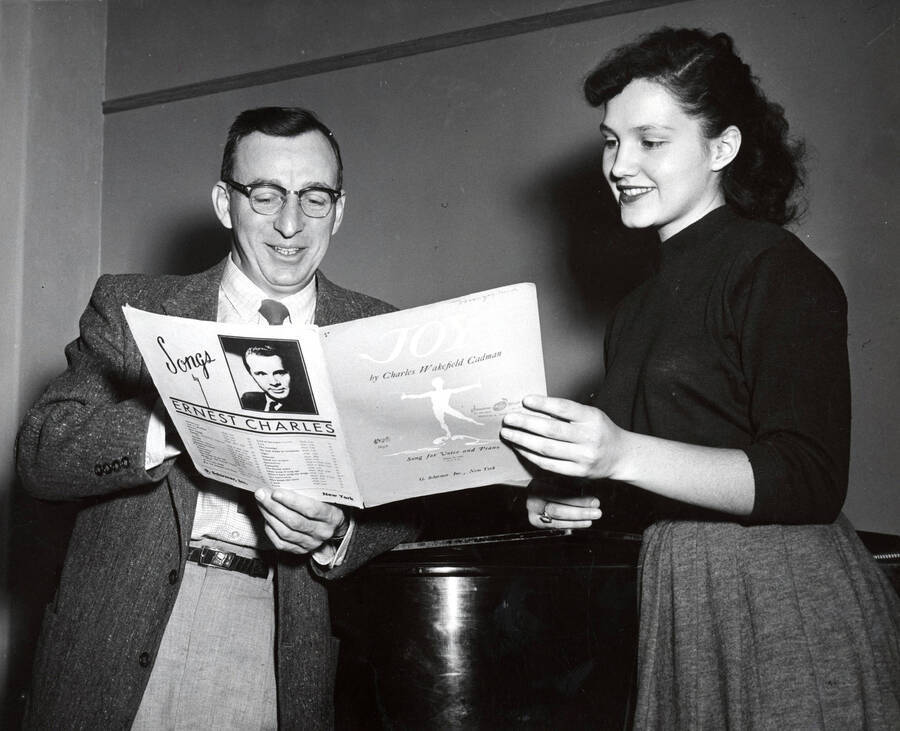 1952 photograph of Music Department. Glen Lockery and Marigay Nelson, student conductor for University of Idaho Vandaleers. [PG1_222-022]