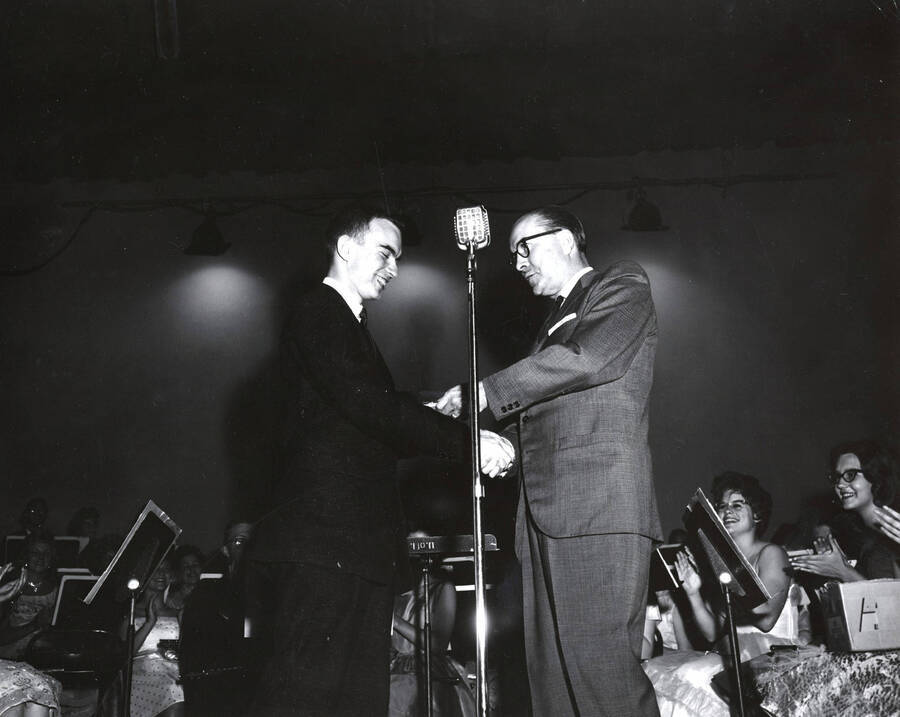 1951 photograph of Music Department. Hall Macklin presenting a summer music camp award to Johnny Musgrove. Donor: Publications Dept. [PG1_222-026]