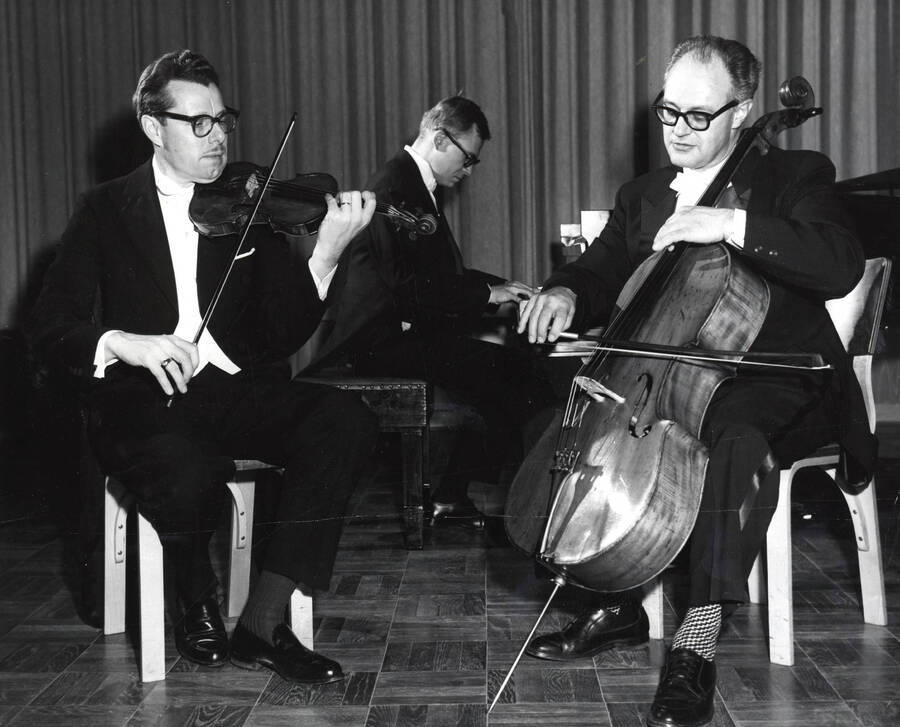 1961 photograph of Music Department. Music Faculty Trio LeRoy Bauer, David Tyler, and David Whisner performing. Donor: Publications Dept. [PG1_222-030]